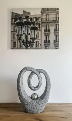 a vase with a spiral on top of a table at Istriana boutique apartment in Nova Gorica