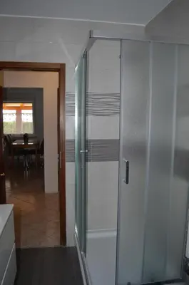 a sliding glass door in a kitchen with a dining room at Apartma Patrik in Kobarid