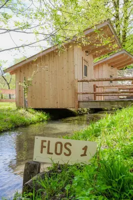 a sign that says flos in front of a house at Kamp na Otoku - Ljubno ob Savinji in Ljubno