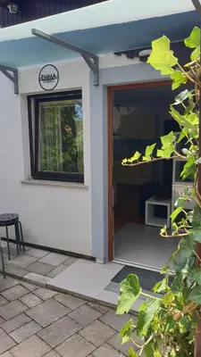 an open door of a house with a patio at Studio EMMA Ljubljana - FREE parking, AC, Wifi in Ljubljana