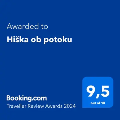 a blue screen with the text awarded to hikka ad potatou at Hiška ob potoku in Dobrna