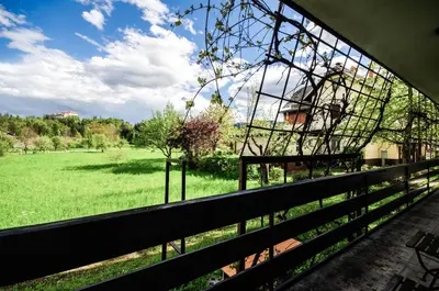 a view of a field from a fence at Deerwood-2-Storey Garden Apartment with Castle view Balcony in Bled