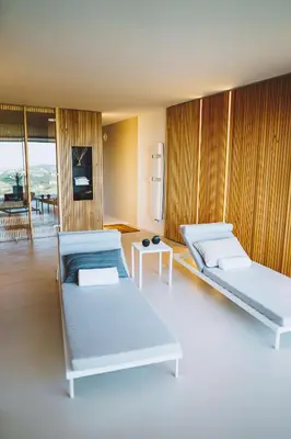 a room with two beds and a table at VILLA ZEROU in Kojsko