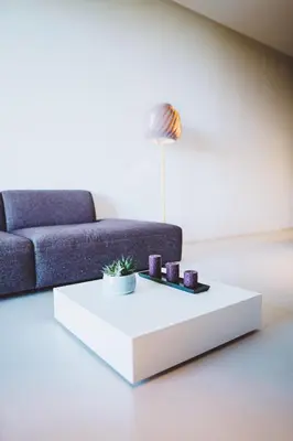 a living room with a couch and a white coffee table at VILLA ZEROU in Kojsko
