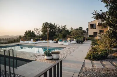 a backyard with a swimming pool and a house at VILLA ZEROU in Kojsko