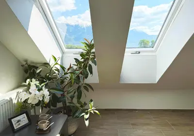 a room with two skylights and a table with plants at Deerwood-Sky Attic with Bled Castle View-NO KITCHEN in Bled