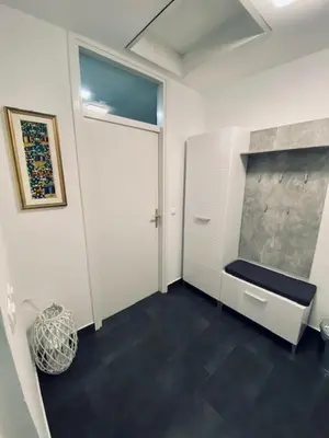 a room with a hallway with a door and a vase at Hiška Orel Terme Čatež in Čatež ob Savi