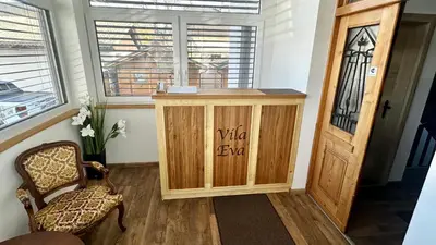 a room with a wooden cabinet and a window at Vila Eva Lesce - Bled in Lesce