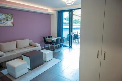 a living room with a couch and a table at Hana - Apartments in Ljubljana