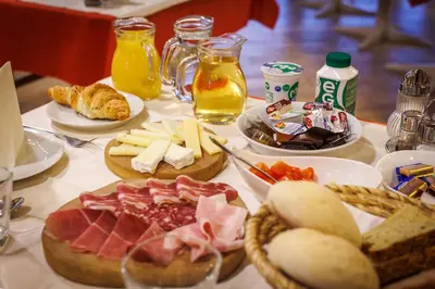 a table topped with plates of food and drinks at Mobile House Vegov hram in Dol pri Ljubljani