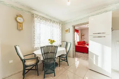 a dining room with a table and chairs at Holiday Homes I&G by the river next to Olimje in Kozje