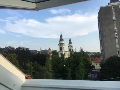 a view from a window of a building with two towers at Apartments Katrca Ljubljana in Ljubljana