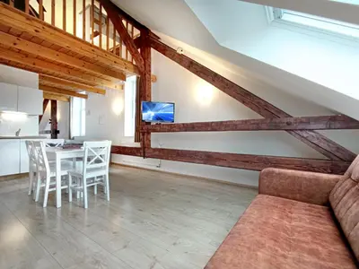 a living room with a couch and a table at Apartments Katrca Ljubljana in Ljubljana