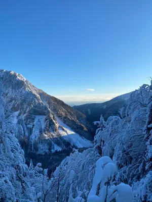 a view from the top of a mountain covered in snow at BeeWood apartment in Križe