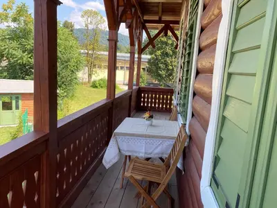 a table on the porch of a house at Villa Ruska dača in Ljubljana