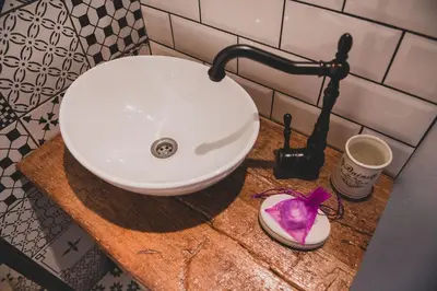 a white sink on a counter in a bathroom at Apartma Cici in Kobarid