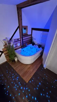 a large bathroom with a tub in a room at Hiša stare mame in Kamnik