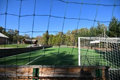 a soccer field with a net on a court at Počitniška hiša Parkfield Dragovan in Metlika