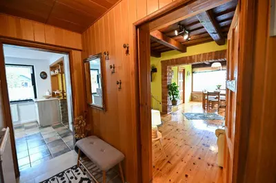 a hallway of a home with a dining room at Počitniška hiša Parkfield Dragovan in Metlika