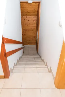 a hallway with stairs in a house at Holiday House Destina - Lake Bohinj in Bohinj