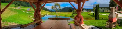 a painting of a pond in a park with a bench at Wooden Chalet - Homestead Vrhovc in Železniki