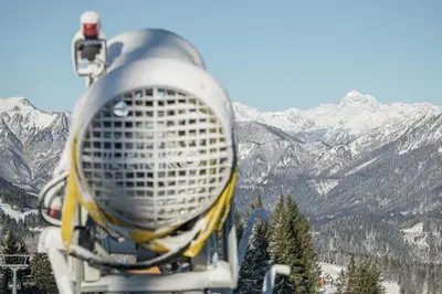 a view of a snow covered mountains from a ski lift at Apartment Perunika in Cerkno