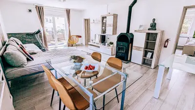 a living room with a table and a couch at LTE Apartments in Maribor