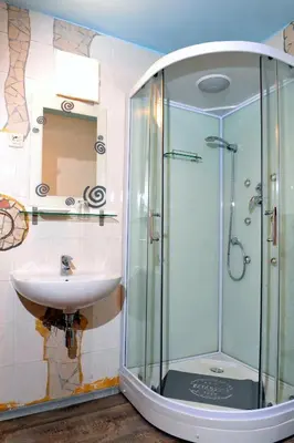 a bathroom with a glass shower and a sink at Gostilna in Prenočišča Brančurnik in Prevalje