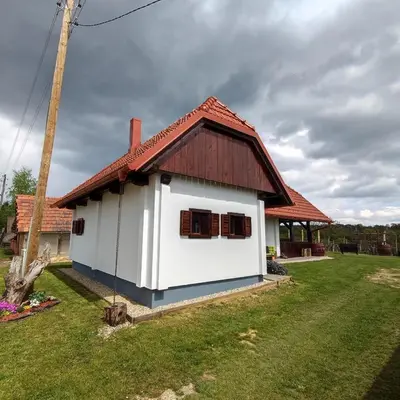 a small white house with a red roof at Vorgova klet in Bogojina
