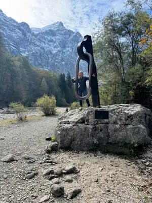 a statue of a man sitting on a rock at 18Home apartments, Mojstrana in Mojstrana