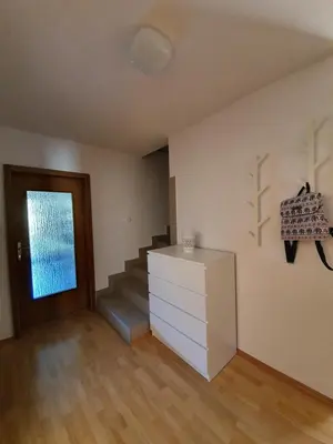 a room with a staircase and a dresser and a door at Green Oasis Anica in Podčetrtek