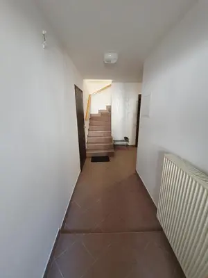 a hallway with a staircase and a stair case at Green Oasis Anica in Podčetrtek