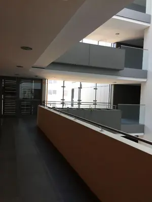 an empty room with a counter in a building at Sunrise Maribor apartment with private parking in Maribor