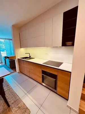 a kitchen with a sink and a stove at Na Vasi restavracija in prenočišča in Škofja Loka