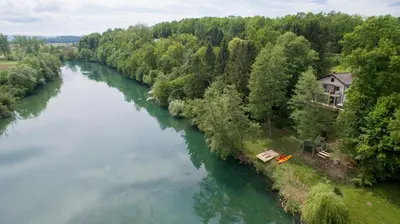 an aerial view of a river with a house at Kolpa Paradise in Metlika