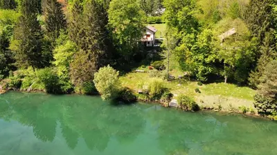 an aerial view of a house next to a river at Kolpa Paradise in Metlika