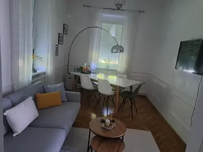 a living room with a couch and a table at Villa Hortensia in Ljubljana