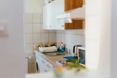 a kitchen with a sink and a counter top at B&B Vransko 29 in Vransko