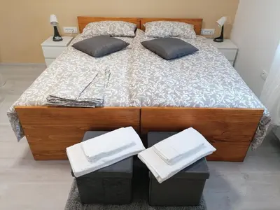 a bedroom with a bed with two pillows on it at Domačija Mirko in Miren