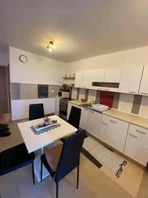 a kitchen with a table and chairs in a room at Turistična kmetija Golej in Podčetrtek