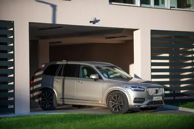 a silver suv parked in front of a garage at Villa de Roya in Rogaška Slatina