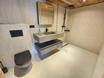 a small bathroom with a sink and a toilet at Apartments Bedanc in Kranjska Gora