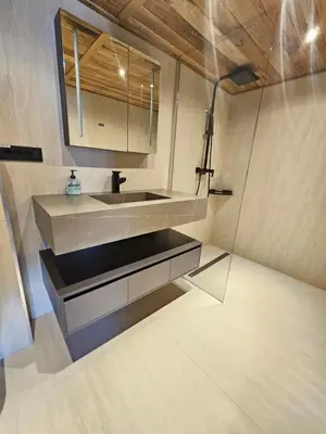 a bathroom with a sink and a mirror at Apartments Bedanc in Kranjska Gora