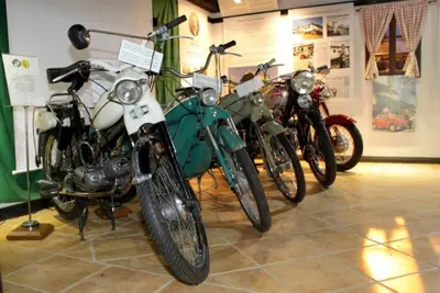 a group of motorcycles parked in a room at Urlaub für die Seele - Erholung Pur in der Natur - Ferienhaus mit Infrarotkabine & RELAX-Raum in Rucmanci