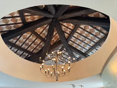 a chandelier hanging from the ceiling of a building at SMARTnoOK Rooms and Apartment in Šmartno