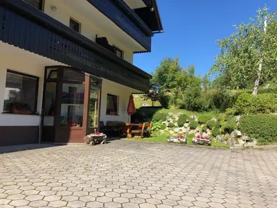 a house with figurines of animals outside of it at Apartment in the heart of nature in Bohinj