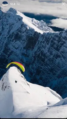 a person on top of a snow covered mountain at Apartment in the heart of nature in Bohinj