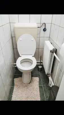 a bathroom with a white toilet in a stall at House Marin - whole house in Maribor