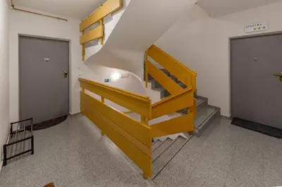 a staircase in a room with a stair case at Timber Apartment in Bohinj