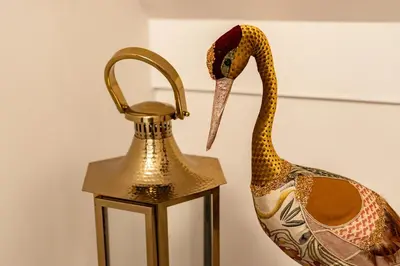 a snake on a vase next to a lamp at Bella Mura Golden Apartment in Moravske Toplice
